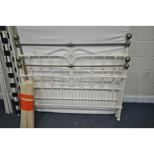 189 - AN UNBRANDED 4FT6 MATTRESS, along  with a tubular metal bedstead, condition report: general signs of... 