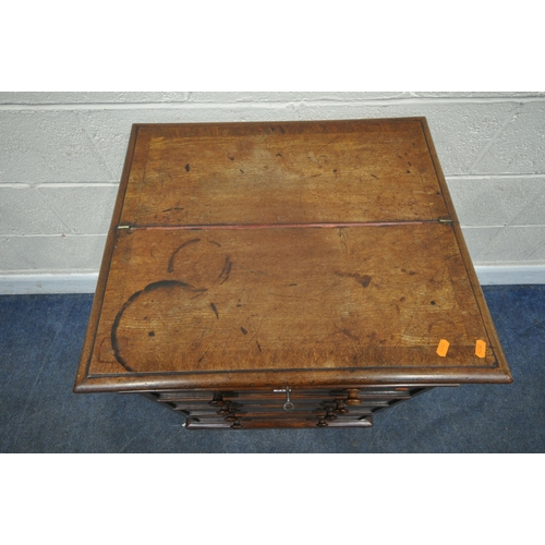 219 - AN EARLY 19TH CENTURY MAHOGANY DAVENPORT, the multidirectional spinning top can move in four directi... 