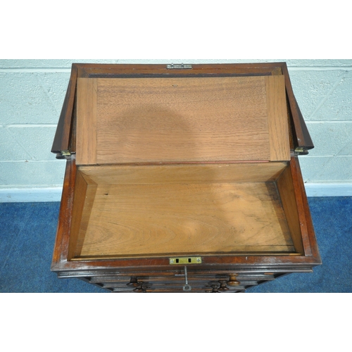 219 - AN EARLY 19TH CENTURY MAHOGANY DAVENPORT, the multidirectional spinning top can move in four directi... 