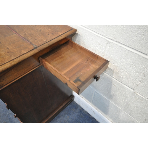 219 - AN EARLY 19TH CENTURY MAHOGANY DAVENPORT, the multidirectional spinning top can move in four directi... 
