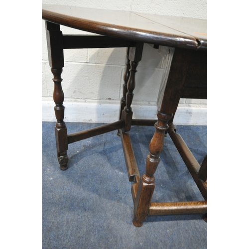 227 - A GEORGIAN OAK GATE LEG TABLE, raised on block and turned legs, open width 105cm x closed width 39cm... 