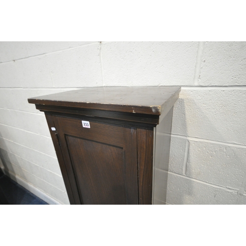 233 - A STAINED PINE CABINET, with a single cupboard door enclosing shelves, width 49cm x depth 33cm x hei... 