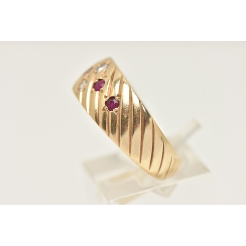 401 - A YELLOW METAL BAND RING, a yellow metal slightly tapered band ring with etched detail, flush set wi... 