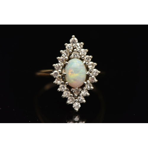 403 - AN OPAL AND DIAMOND CLUSTER RING, a high oval cabochon opal set with a surround of twenty two single... 