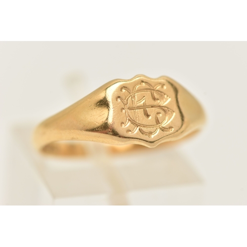 405 - AN 18CT GOLD SIGNET RING, a yellow gold shield form signet ring with monogram engraving, hallmarked ... 