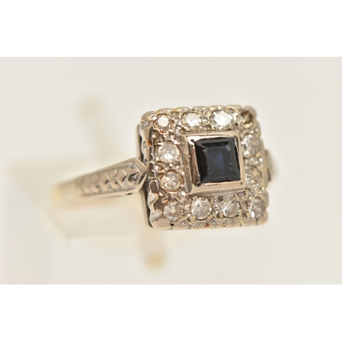 409 - AN 18CT GOLD GEM SET RING, a square form design cluster ring, principally set with a square cut sapp... 