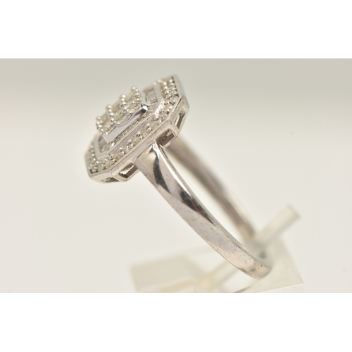 410 - A WHITE METAL DIAMOND CLUSTER RING, approximately thirty four round brilliant cut diamonds and appro... 