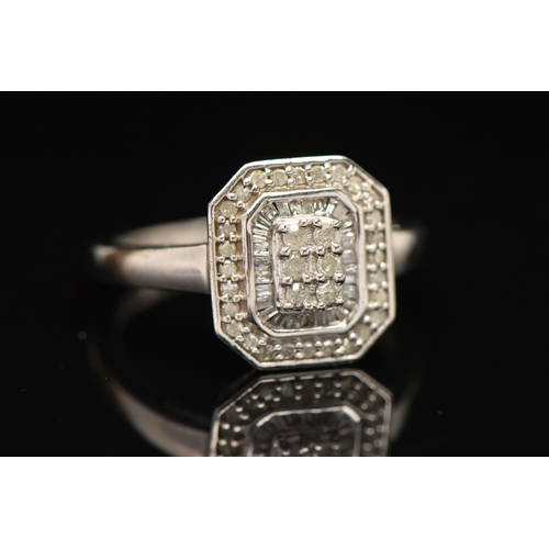 410 - A WHITE METAL DIAMOND CLUSTER RING, approximately thirty four round brilliant cut diamonds and appro... 