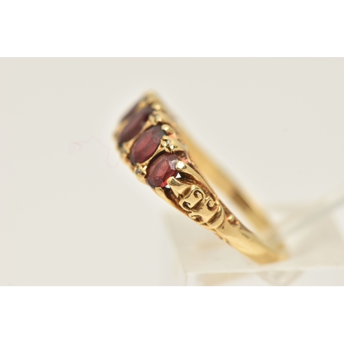 412 - AN 18CT GOLD GARNET AND DIAMOND RING, set with five oval cut graduated garnets, with small single cu... 
