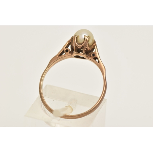 414 - A 9CT GOLD CULTURED PEARL RING, a single cream pearl measuring approximately 6mm, sitting slanted in... 