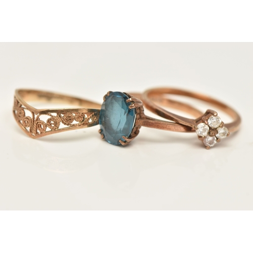 415 - THREE 9CT GOLD RINGS, the first set with a blue topaz, hallmarked 9ct Birmingham, ring size M, the s... 