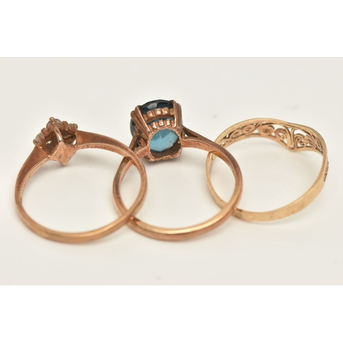 415 - THREE 9CT GOLD RINGS, the first set with a blue topaz, hallmarked 9ct Birmingham, ring size M, the s... 