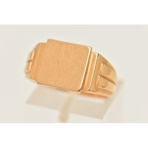 416 - A GENTS YELLOW METAL SIGNET RING, of a square polished form, textured shoulders and a polished band,... 