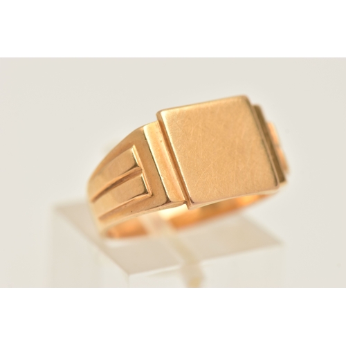416 - A GENTS YELLOW METAL SIGNET RING, of a square polished form, textured shoulders and a polished band,... 