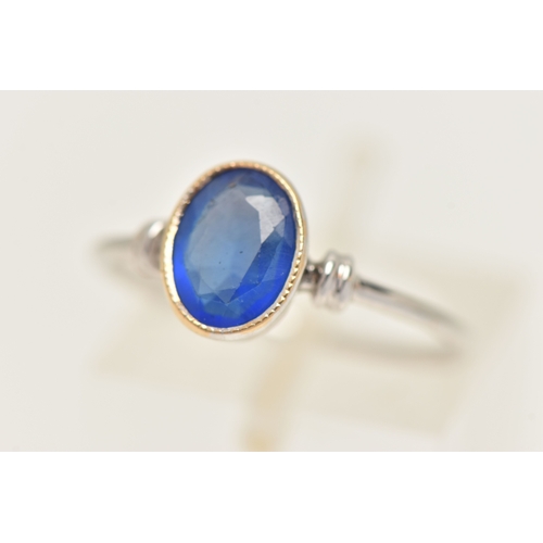 419 - A WHITE METAL GARNET TOPPED DOUBLET RING, designed as an oval cut blue paste with garnet top, milgra... 
