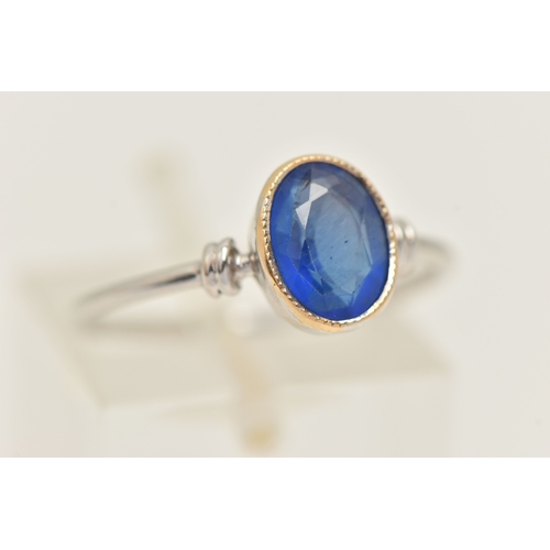 419 - A WHITE METAL GARNET TOPPED DOUBLET RING, designed as an oval cut blue paste with garnet top, milgra... 