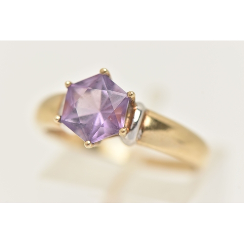 420 - A 9CT GOLD AMETHYST RING, set with a fancy cut amethyst, claw set to the polished band, hallmarked 9... 