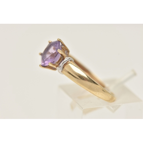 420 - A 9CT GOLD AMETHYST RING, set with a fancy cut amethyst, claw set to the polished band, hallmarked 9... 