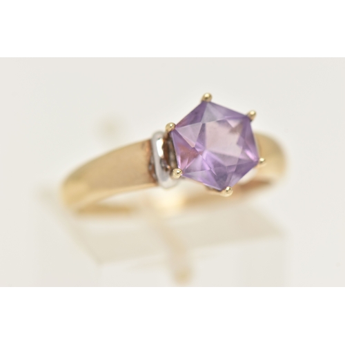 420 - A 9CT GOLD AMETHYST RING, set with a fancy cut amethyst, claw set to the polished band, hallmarked 9... 
