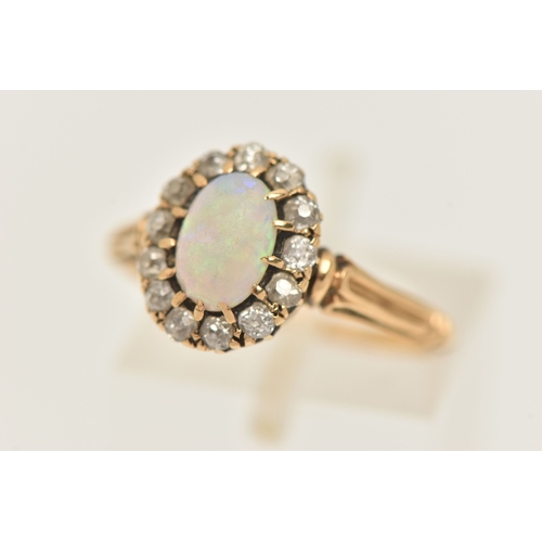 421 - A YELLOW METAL OPAL AND DIAMOND CLUSTER RING, of an oval form, set with a central oval cut white opa... 