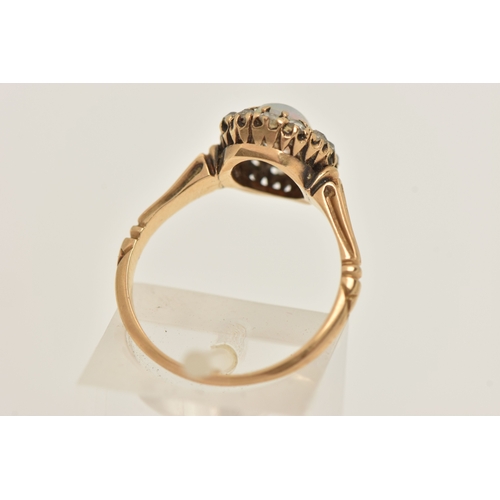 421 - A YELLOW METAL OPAL AND DIAMOND CLUSTER RING, of an oval form, set with a central oval cut white opa... 