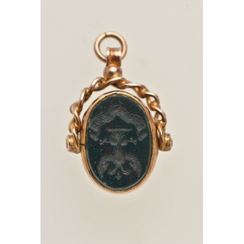 424 - A YELLOW METAL SWIVEL FOB, of an oval form set with an intaglio bloodstone inlay and polished bloods... 