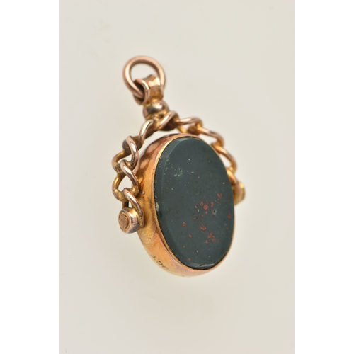 424 - A YELLOW METAL SWIVEL FOB, of an oval form set with an intaglio bloodstone inlay and polished bloods... 