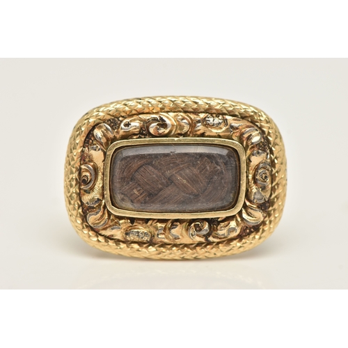 427 - A YELLOW METAL HAIR WORK MEMORIAL BROOCH, of a rounded rectangular form with a central brown woven h... 