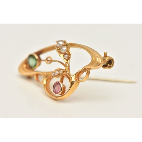 428 - A CASED YELLOW METAL GEM SET BROOCH, of an open work design, set with a pink and a green tourmaline ... 