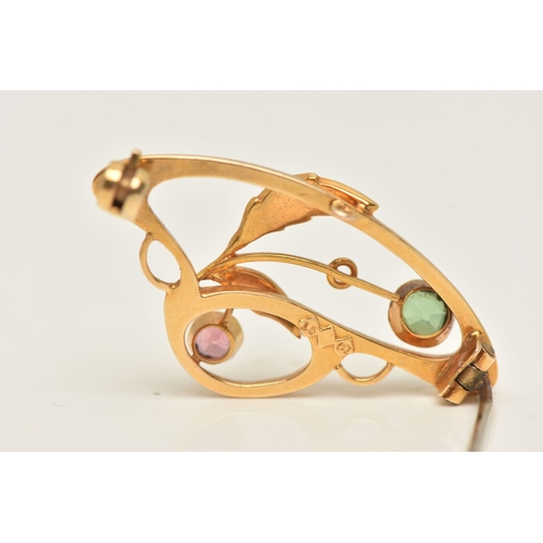 428 - A CASED YELLOW METAL GEM SET BROOCH, of an open work design, set with a pink and a green tourmaline ... 