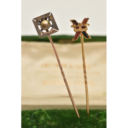 430 - TWO STICK PINS, the first a yellow metal stick pin with cross and crown detail, set with hard stone,... 