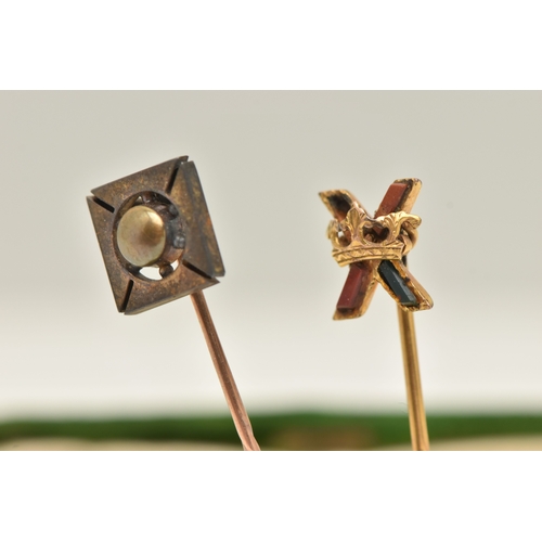430 - TWO STICK PINS, the first a yellow metal stick pin with cross and crown detail, set with hard stone,... 