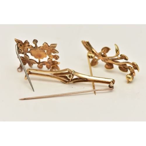 436 - THREE LATE 19TH TO EARLY 20TH CENTURY BROOCHES, the first a yellow metal split pearl set foliate bro... 