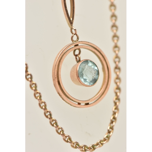 438 - A ROSE METAL GEM SET PENDANT NECKLACE, the pendant of an open work circular form set with a light bl... 