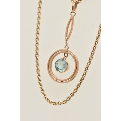 438 - A ROSE METAL GEM SET PENDANT NECKLACE, the pendant of an open work circular form set with a light bl... 