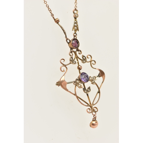 443 - AN EARLY 20TH CENTURY GEM SET LAVALIER PENDANT AND CHAIN, rose metal open work pendant, set with a c... 