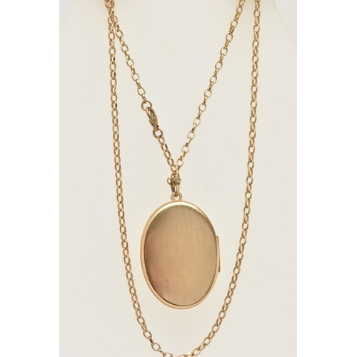 444 - A 9CT GOLD OVAL LOCKET PENDANT WITH CHAIN, the oval locket decorated with a floral pattern, opens to... 