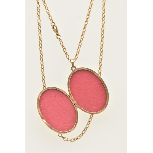 444 - A 9CT GOLD OVAL LOCKET PENDANT WITH CHAIN, the oval locket decorated with a floral pattern, opens to... 