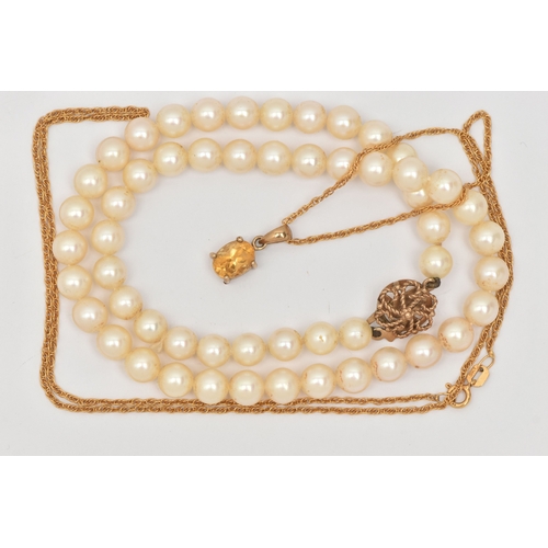 449 - TWO NECKLACES, the first an oval cut Citrine pendant in a yellow metal mount with tapered bail, unma... 