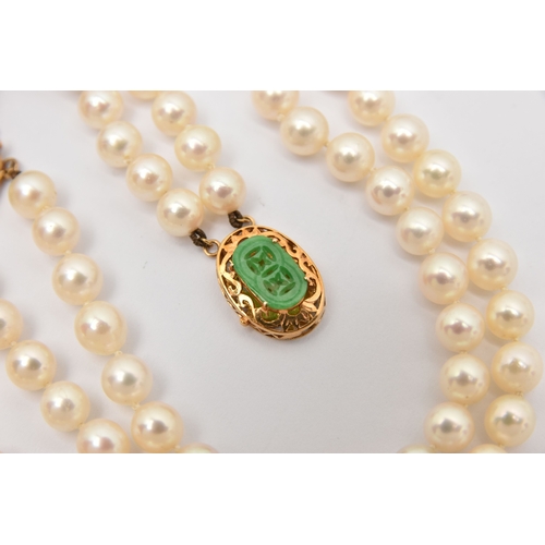 451 - A CULTURED PEARL NECKLACE AND BRACELET, designed as a cultured pearl double strand necklace, approxi... 