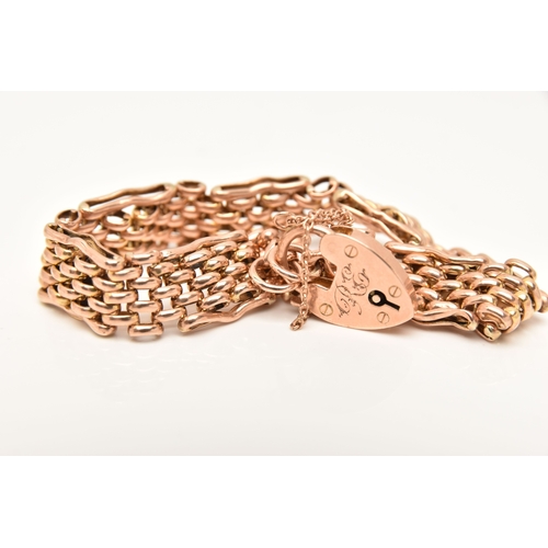 452 - A ROSE METAL BRACELET, a brick link bracelet fitted with a heart padlock clasp, stamped 9ct, approxi... 
