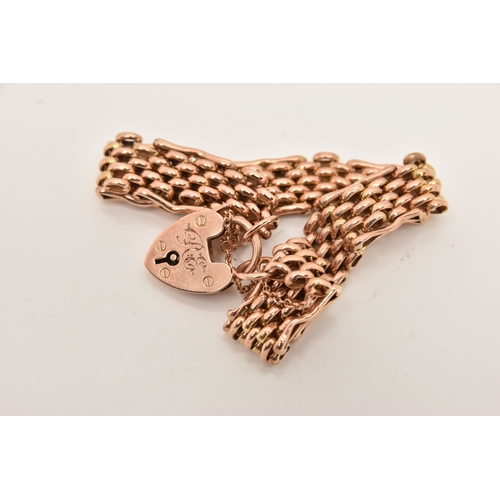 452 - A ROSE METAL BRACELET, a brick link bracelet fitted with a heart padlock clasp, stamped 9ct, approxi... 