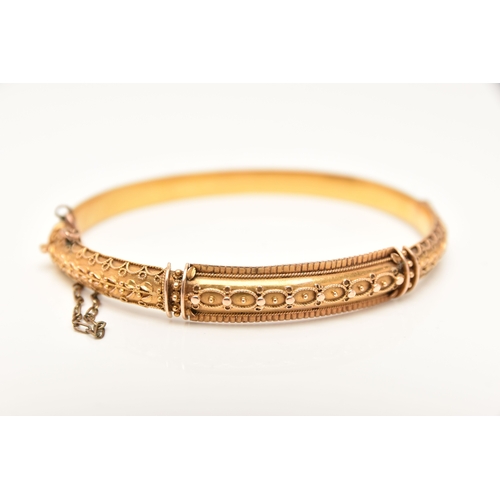 453 - A LATE VICTORIAN 15CT GOLD HINGED BANGLE, Etruscan design with applied bead work, fitted with a push... 