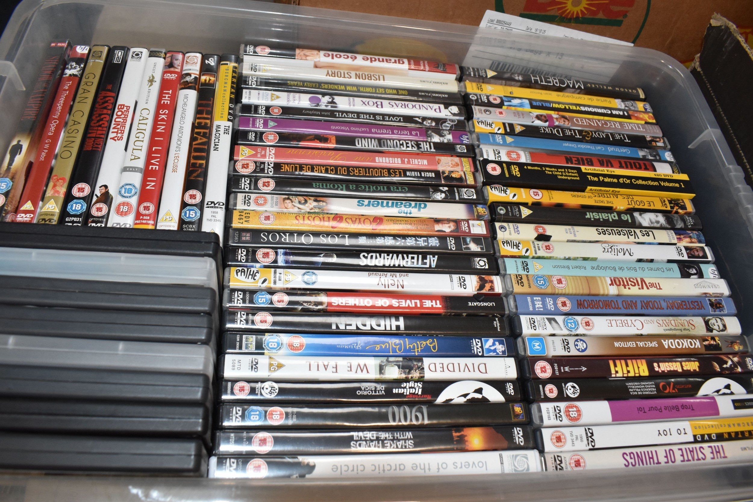 TWO BOXES OF DVDS & BLU-RAY containing 131 miscellaneous film titles ...