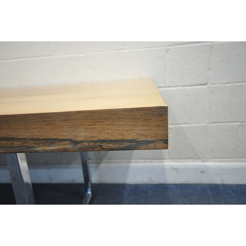 150 - IN THE MANNER OF MERROW ASSOCIATES, A MID-CENTURY ROSEWOOD RECTANGULAR DINING TABLE, raised on squar... 