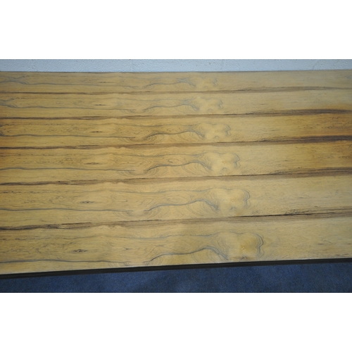 150 - IN THE MANNER OF MERROW ASSOCIATES, A MID-CENTURY ROSEWOOD RECTANGULAR DINING TABLE, raised on squar... 