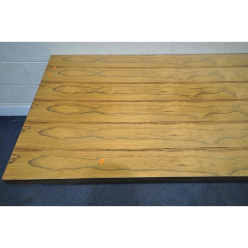 150 - IN THE MANNER OF MERROW ASSOCIATES, A MID-CENTURY ROSEWOOD RECTANGULAR DINING TABLE, raised on squar... 