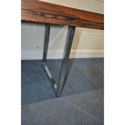 150 - IN THE MANNER OF MERROW ASSOCIATES, A MID-CENTURY ROSEWOOD RECTANGULAR DINING TABLE, raised on squar... 