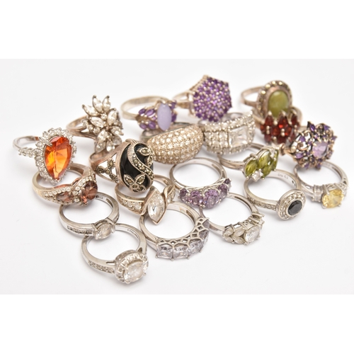 AN ASSORTMENT OF WHITE METAL RINGS, twenty rings in total, some set ...