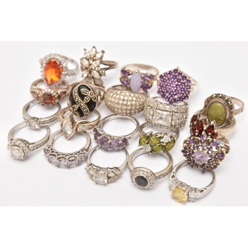 AN ASSORTMENT OF WHITE METAL RINGS, twenty rings in total, some set ...